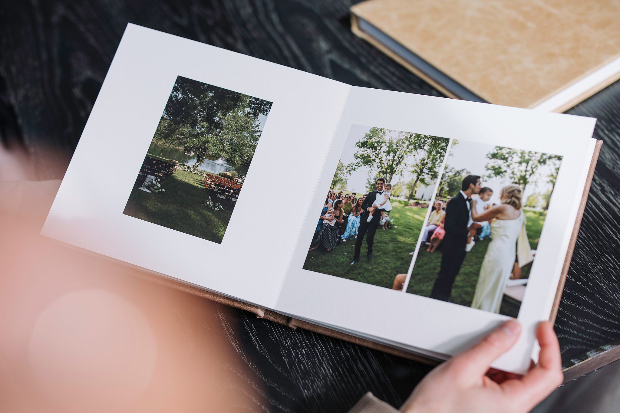 An open Fine Art Album showing a printed wedding spread