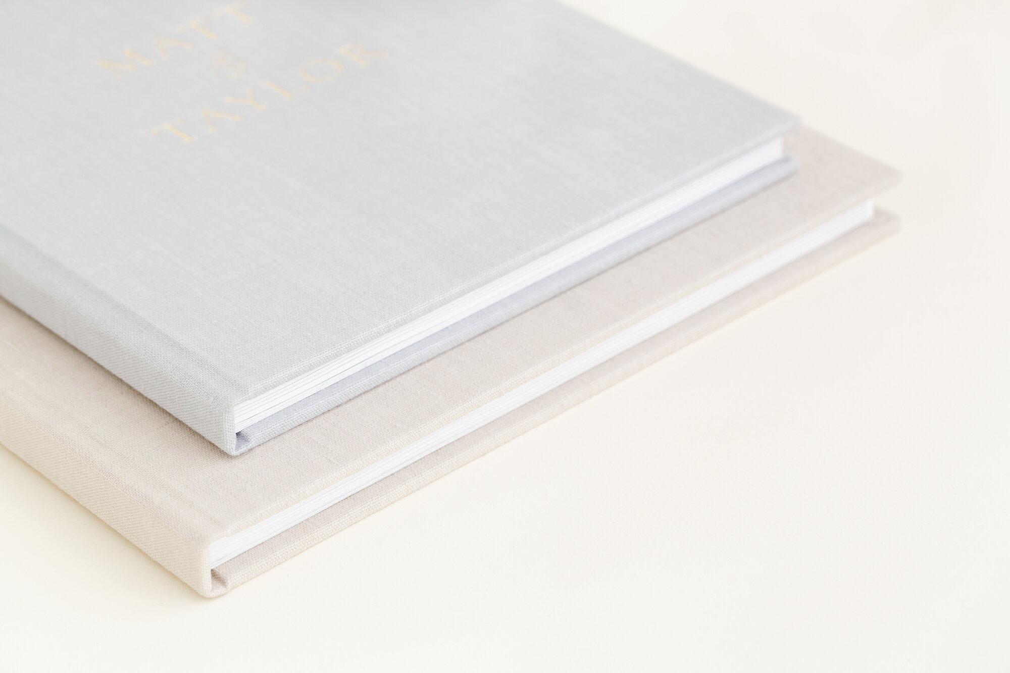 Gold foil debossing on a pair of stacked linen Hardcover Books