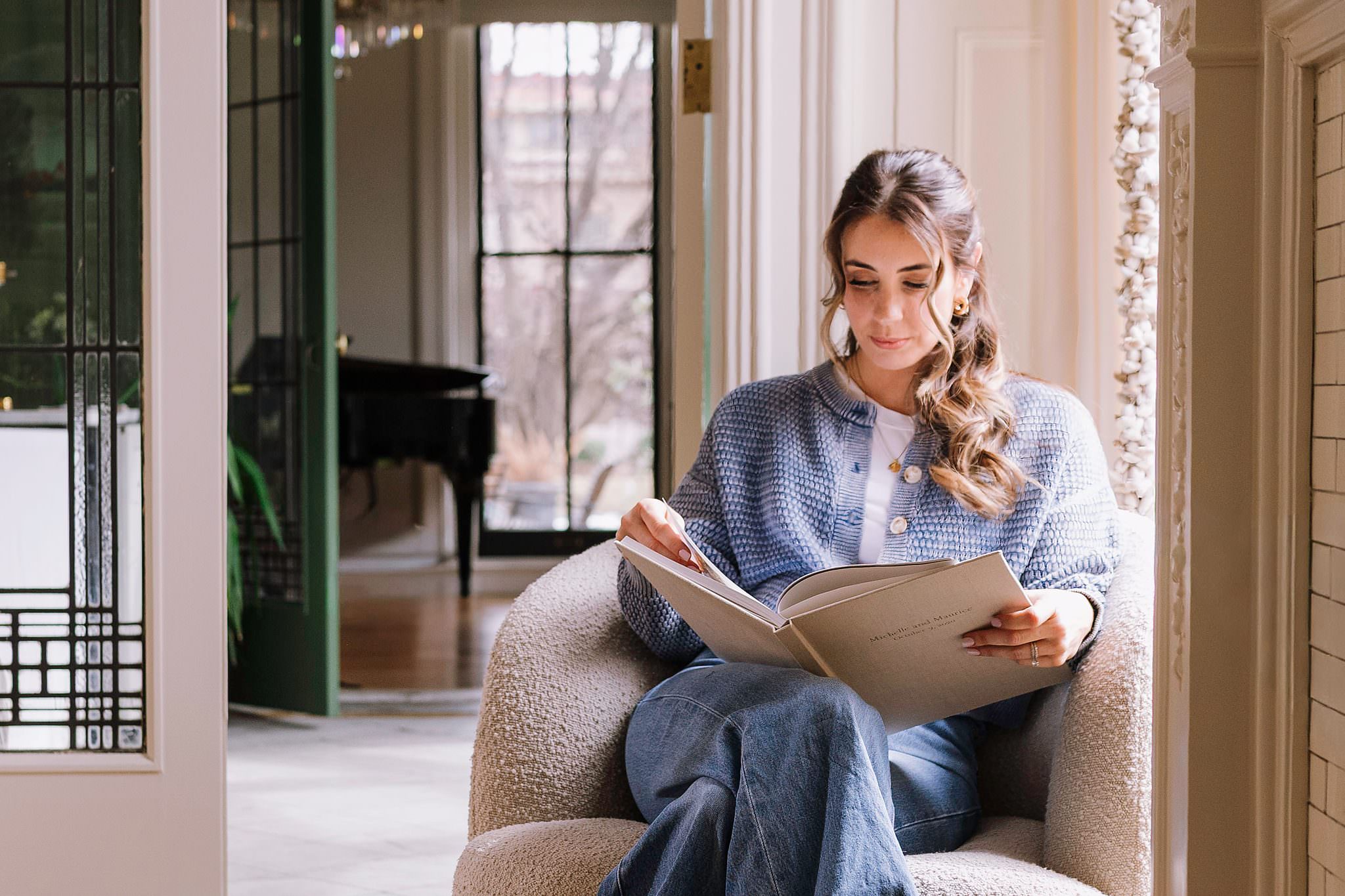 A woman reading her Hardcover Book in a quiet sitting room