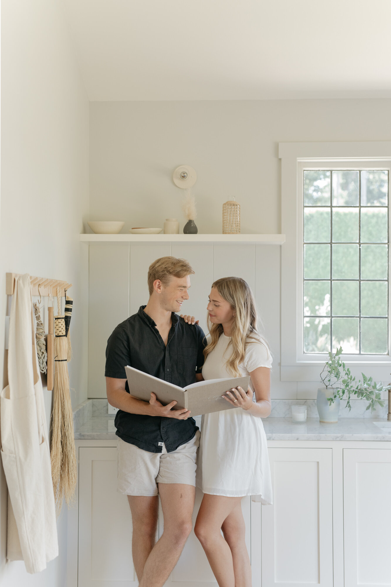 A couple looking through their Hardcover Book together