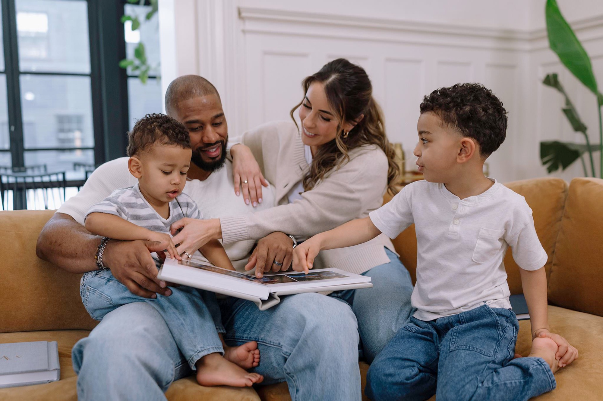Father and child looking at a RedTree folio album together