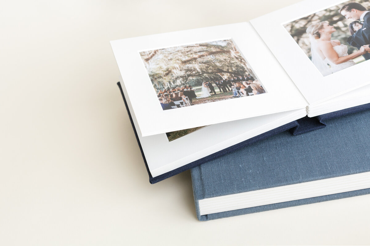 Open matted folio album with two matted print pages